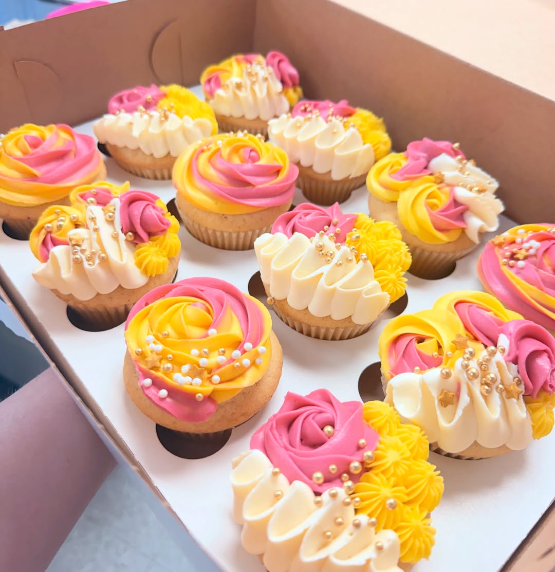 Box of custom decorated cupcakes